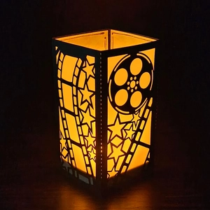 Movie themed black paper lantern with film roll hollow pattern and warm night light