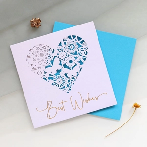 Detailed laser-cut heart pattern greeting card with gold Best Wishes foil and blue envelope