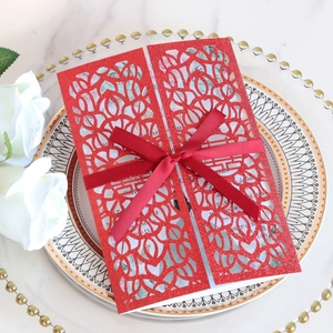 Laser-cut red glitter wedding invitation card with Double Happiness and silk bow