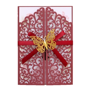 Elegant red laser-cut wedding invitation with gold butterfly and silk ribbon bow