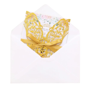 Glitter gold laser-cut invitation with floral card, satin bow, and white envelope set