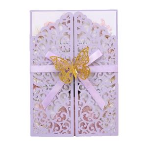 Elegant purple laser-cut wedding invitation with silk ribbon and golden butterfly detail