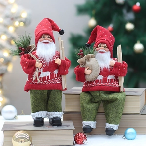 Close-up of standing and sitting Santa figurines with red reindeer knit sweaters and beard