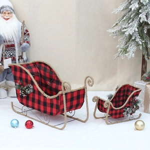 Red buffalo plaid Christmas sled set with pine cones and needles for holiday decoration