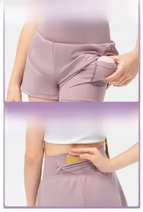 Detail view of girls pink sports shorts with hidden side pocket and rear waist pocket