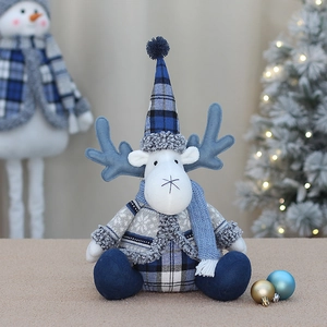 Blue fabric Christmas reindeer plush toy with pointy hat for festive window display