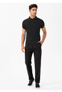 Full body view of men's black quick-dry sports polo shirt with neon trim and matching pants