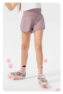 Detail of girls breathable purple sports shorts with wide high-waist elastic waistband
