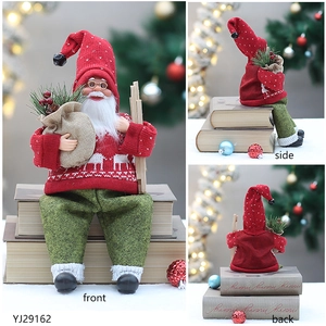Three-way view of Santa gnome with red knit hat, gold glasses, and wooden skis