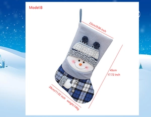 Blue knit Christmas stocking with snowman detail and size dimensions in cm and inches