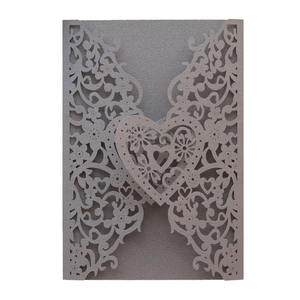 Laser cut heart wedding invitation sleeve in white pearlescent paper with floral pattern