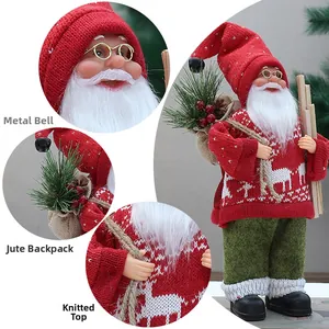Detail of 12-inch Santa Claus figurine featuring a knit hat, bell, and burlap backpack