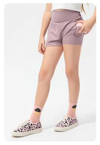 Girl's fitness set featuring pink skort with side pocket for tennis balls and white vest