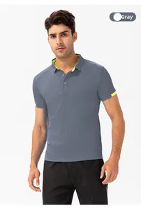 Detail of grey men's polo shirt with neon green contrast lines and honeycomb fabric texture