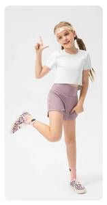 Detail of girls' quick-dry running set with white cropped tee and lilac purple shorts
