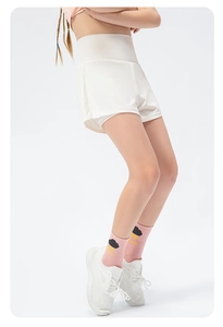 Detail view of white high-waisted 2-in-1 shorts with quick-dry inner layer and pleated hem