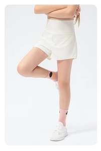 Close-up of girls' white high-waist quick-dry sports shorts with breathable mesh fabric