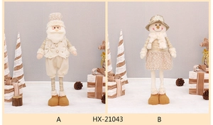 Detailed view of plush Christmas doll in champagne and gold tones with sequin accents