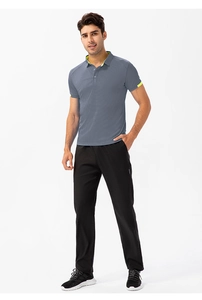 Detail view of men's athletic polo shirt with fluorescent green edge piping