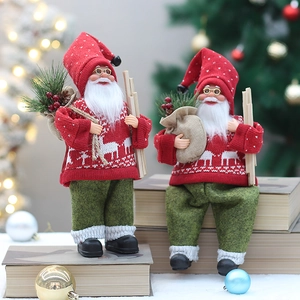 Standing and sitting red knit Santa Claus figurines with elk patterns for Christmas decor