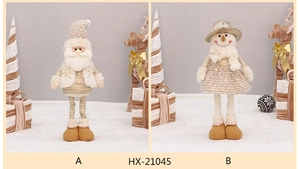 Detail of Christmas plush gnomes in beige and gold with sequined fabric and long legs