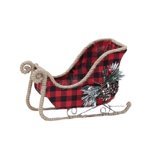 Rustic buffalo plaid Christmas sleigh decor with pine cones and festive berries