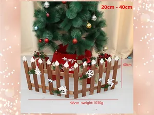 Detail of wooden Christmas tree fence with snowflake carvings and fake snow effect decoration