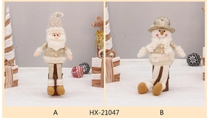 Detail of plush Christmas Santa and snowman dolls with champagne sequins and striped fabric