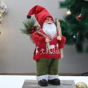 Standing Christmas Santa Claus doll in red knitted sweater with reindeer pattern and sack