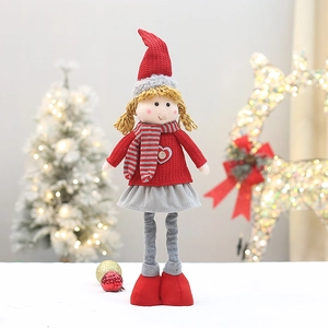 Detail of a 59cm retractable Christmas doll with red knitted hat and long braided hair