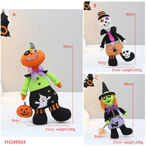 Detailed view of Halloween fabric dolls including pumpkin, skeleton, and witch styles