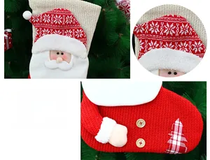 Detail of red and white knitted Christmas stocking featuring a 3D Santa with wooden button