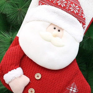 Knitted 18-inch red Christmas stocking with plush Santa Claus and wooden button accents