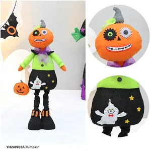 Detail of Halloween long-legged pumpkin doll featuring gear eyes and ghost print fabric