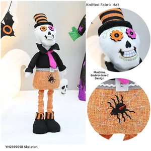 Detail of embroidered spider web pattern on orange Halloween skeleton plush ornament