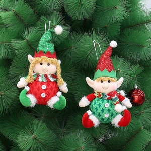 Christmas elf plush pendants with sequined hats and striped scarves on a green tree