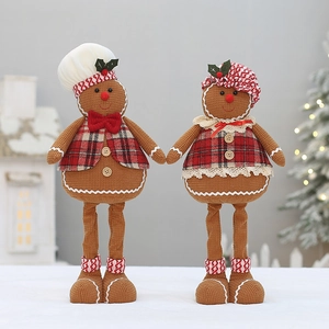 Pair of plush gingerbread man Christmas decorations with waffle texture and plaid vests