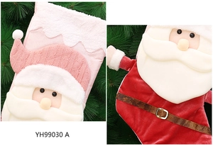 Detail showing two festive plush Christmas stockings with 3D Santa Claus and knit patterns