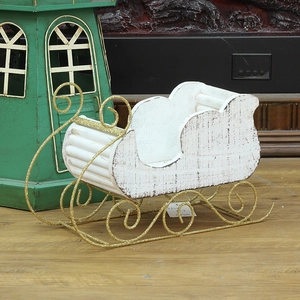 Rustic white wood Christmas sleigh ornament with golden glitter metal scroll base
