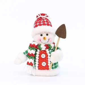 Mini bonhomme de neige de Noël en peluche avec bonnet rouge et une petite pelle