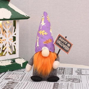 Standing Halloween gnome with purple hat, orange beard, and Happy Halloween sign