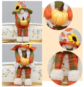 Macro detail of plush autumn gnomes featuring sunflowers, pumpkins and felt textures