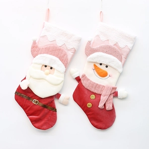 Set of 2 plush Christmas stockings featuring Santa and Snowman hanging decorations