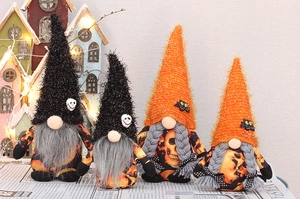 Detailed set of four Halloween plush gnomes with skull motifs and pointed festive hats
