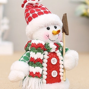 Mini bonhomme de neige en peluche avec bonnet à carreaux, écharpe verte et pelle en bois