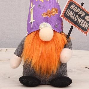 Standing Halloween gnome with orange beard and purple hat holding Happy Halloween sign