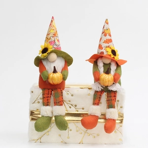 Harvest Festival Thanksgiving gnomes with sunflowers, pumpkins and maple leaf decorations