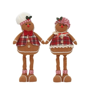 Pair of plush gingerbread man dolls in festive chef and lace outfits for Christmas decor