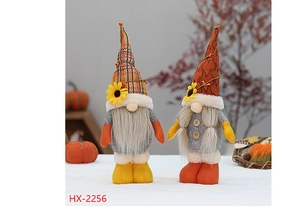 Macro detail of gnome dolls with sunflower hats and fall harvest themed decorations