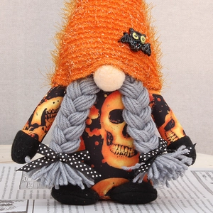 Detail of Halloween gnome featuring a sparkly orange hat with black bat and skull print body